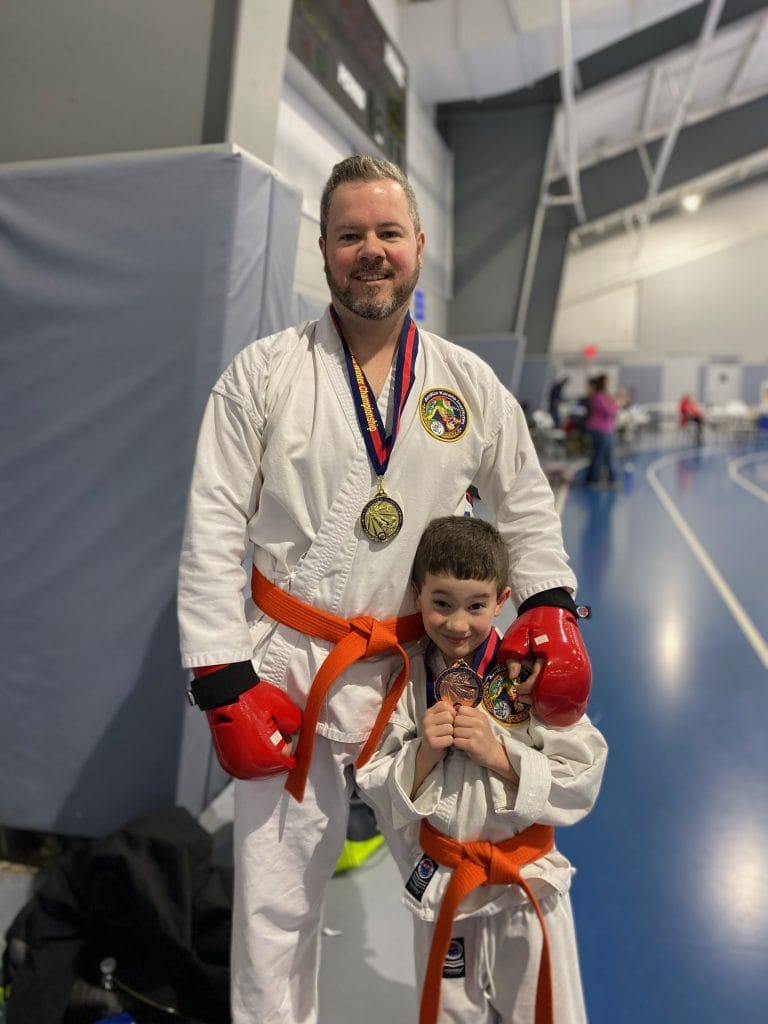 Father and son competing at a martial arts competition